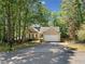 Charming single-story home featuring a two-car garage and well-maintained landscaping at 614 Springharbor Dr, Woodstock, GA 30188