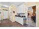 Hallway with wood floors, white cabinets and a view of the living room at 614 Springharbor Dr, Woodstock, GA 30188
