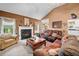 Open living area featuring a fireplace and cozy seating with a view to the kitchen at 614 Springharbor Dr, Woodstock, GA 30188