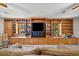 Living room featuring built-in shelving and a large television, offering plenty of storage and entertainment options at 614 Springharbor Dr, Woodstock, GA 30188