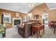 Bright living space with a fireplace, comfortable seating, and seamless flow to the dining and kitchen areas at 614 Springharbor Dr, Woodstock, GA 30188