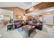 Open-concept living room with comfortable seating and vaulted ceiling, flowing into the dining area at 614 Springharbor Dr, Woodstock, GA 30188