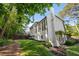 Beautiful backyard featuring a large deck, expansive lawn and mature trees providing privacy at 7115 Doncaster Ct, Cumming, GA 30040