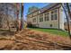 Spacious backyard featuring well-maintained landscaping and a large deck perfect for outdoor entertaining at 7115 Doncaster Ct, Cumming, GA 30040