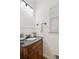 Charming half bathroom with wooden vanity, black countertop, and decorative accents at 7115 Doncaster Ct, Cumming, GA 30040