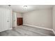 Spacious bedroom with neutral walls and hardwood flooring at 7115 Doncaster Ct, Cumming, GA 30040