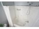 Clean bathroom featuring a shower with white tile and modern fixtures for a pristine feel at 10 Perimeter Summit Ne Blvd # 2207, Brookhaven, GA 30319