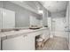 Bathroom featuring double sinks, tile floors, and a shower/tub combo at 10 Perimeter Summit Ne Blvd # 2207, Brookhaven, GA 30319