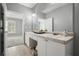 Bathroom vanity with double sinks, tile countertop, and large mirror, offering ample space at 10 Perimeter Summit Ne Blvd # 2207, Brookhaven, GA 30319