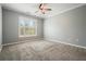 Spacious bedroom with neutral carpet, ceiling fan, and shuttered windows offering ample natural light at 10 Perimeter Summit Ne Blvd # 2207, Brookhaven, GA 30319