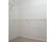 Walk-in closet with shelving providing storage space at 10 Perimeter Summit Ne Blvd # 2207, Brookhaven, GA 30319