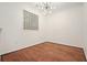 Bright dining room with hardwood floors, glass block window, and modern chandelier at 10 Perimeter Summit Ne Blvd # 2207, Brookhaven, GA 30319