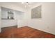 Dining room featuring hardwood floors, glass block window, and a view of the kitchen at 10 Perimeter Summit Ne Blvd # 2207, Brookhaven, GA 30319