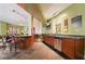 A game room with a kitchenette, bar seating, and wall-mounted TV is ready for fun at 10 Perimeter Summit Ne Blvd # 2207, Brookhaven, GA 30319