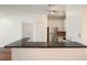 The kitchen featuring sleek black countertops and white cabinets, perfect for modern living at 10 Perimeter Summit Ne Blvd # 2207, Brookhaven, GA 30319