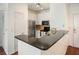 Modern kitchen features stainless steel appliances, granite countertops, and white cabinetry at 10 Perimeter Summit Ne Blvd # 2207, Brookhaven, GA 30319