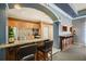 A kitchenette with stainless steel appliances, granite countertop bar, and ample lighting at 10 Perimeter Summit Ne Blvd # 2207, Brookhaven, GA 30319