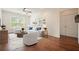 Bright living room with hardwood floors, stylish furniture, and natural light from a large window at 10 Perimeter Summit Ne Blvd # 2207, Brookhaven, GA 30319