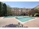 Community pool surrounded by lush greenery and lounge chairs at 10 Perimeter Summit Ne Blvd # 2207, Brookhaven, GA 30319