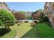 Villa Sonoma Condominium pool with trees, landscaping, and lounge chairs at 10 Perimeter Summit Ne Blvd # 2207, Brookhaven, GA 30319