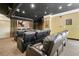 A theater room with multiple leather recliners, a screen, and dark ceilings provides immersive entertainment at 10 Perimeter Summit Ne Blvd # 2207, Brookhaven, GA 30319