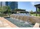 Attractive water feature with community signage amidst lush landscaping and modern architecture at 10 Perimeter Summit Ne Blvd # 2207, Brookhaven, GA 30319