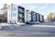 Modern building complex with a well-maintained parking lot and contemporary architecture at 1155 Custer Se Ave # 201, Atlanta, GA 30316