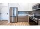 Well-equipped kitchen with stainless steel appliances and a stylish backsplash at 1155 Custer Se Ave # 201, Atlanta, GA 30316