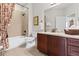 Well-lit bathroom featuring a tub-shower combo, a stylish vanity with great storage, and modern fixtures at 1304 Brookhavenrun Cir, Duluth, GA 30097