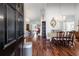 Elegant foyer with hardwood floors, chandeliers, dining room, and living room views at 1304 Brookhavenrun Cir, Duluth, GA 30097