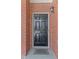 Close up of black front door with house number and traditional brick surround at 1304 Brookhavenrun Cir, Duluth, GA 30097