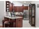 Open kitchen with stainless steel appliances, granite countertops, and tile flooring at 1304 Brookhavenrun Cir, Duluth, GA 30097