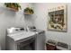 Clean laundry room featuring a washer and dryer with nice decor at 1304 Brookhavenrun Cir, Duluth, GA 30097