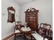 Inviting sitting room with hardwood floors, antique furniture, and natural light at 1304 Brookhavenrun Cir, Duluth, GA 30097
