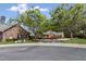Community street view featuring well-maintained homes with mature trees, landscaping, and a welcoming neighborhood feel at 1304 Brookhavenrun Cir, Duluth, GA 30097