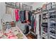 Organized walk-in closet with shelving, hanging space, and drawers at 1304 Brookhavenrun Cir, Duluth, GA 30097