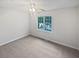 Well-lit bedroom with a large window and ceiling fan at 1307 Chandler Nw Ct, Acworth, GA 30102