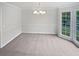 Open dining area featuring ample natural light, chair rail and neutral carpet at 1307 Chandler Nw Ct, Acworth, GA 30102