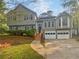 Charming two-story home with attached two car garage and landscaped front yard at 1307 Chandler Nw Ct, Acworth, GA 30102