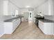Bright kitchen featuring new cabinets, granite countertops, stainless steel appliances, and tiled floors at 1307 Chandler Nw Ct, Acworth, GA 30102