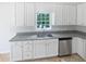 Kitchen featuring stainless steel appliances, granite countertops, and white cabinetry at 1307 Chandler Nw Ct, Acworth, GA 30102