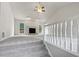 Bright living room featuring a fireplace, plush carpet, and abundant natural light at 1307 Chandler Nw Ct, Acworth, GA 30102