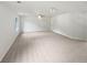Spacious living room with neutral carpet, ceiling fan, and a well-lit atmosphere at 1307 Chandler Nw Ct, Acworth, GA 30102