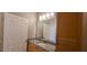 Bright bathroom featuring a granite-topped vanity and ample storage at 400 17Th St # 1114, Atlanta, GA 30318