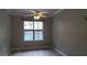Bedroom with a ceiling fan, a large window, and neutral walls at 400 17Th St # 1114, Atlanta, GA 30318