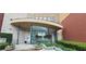 Modern building entrance featuring glass walls, natural stone accents and lovely landscaping at 400 17Th St # 1114, Atlanta, GA 30318