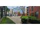 Apartment complex exterior with landscaping and seating area with trellis at 400 17Th St # 1114, Atlanta, GA 30318