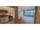 Bright kitchen featuring white cabinets, stainless steel appliances, and a mosaic tile backsplash at 400 17Th St # 1114, Atlanta, GA 30318