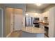 Well-lit kitchen features white cabinets, stainless steel appliances, and granite countertops at 400 17Th St # 1114, Atlanta, GA 30318