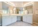 Spacious bathroom featuring a tiled floor, and vanities, and modern light fixtures at 1010 Forest Creek Dr, Canton, GA 30115